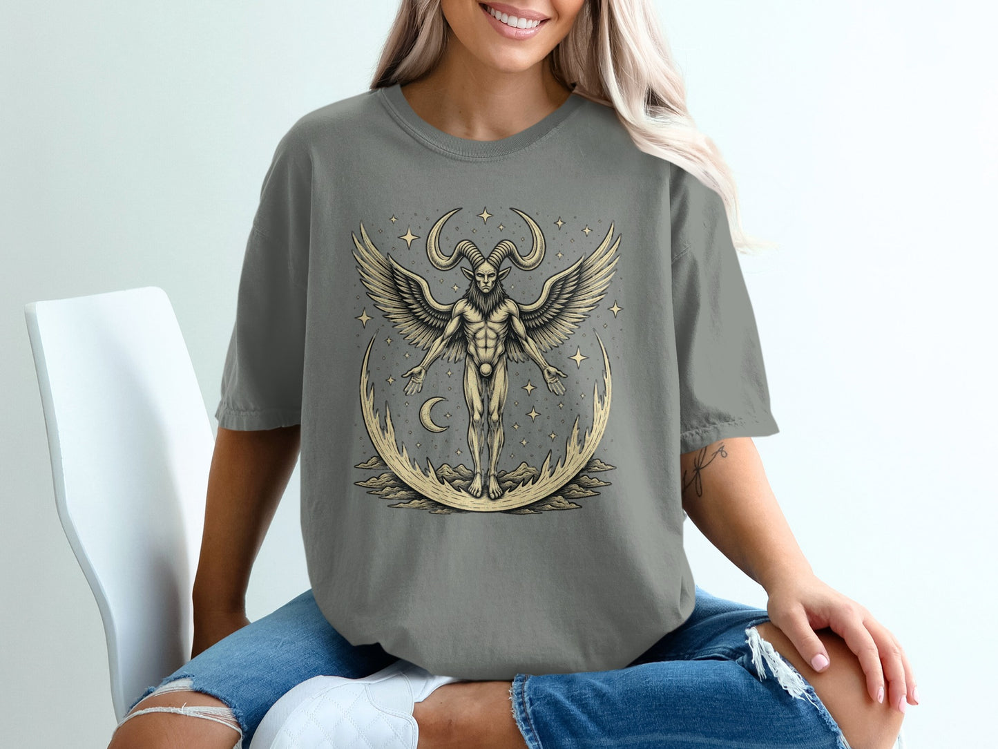 Winged Horned Figure on Moon Graphic Tee product