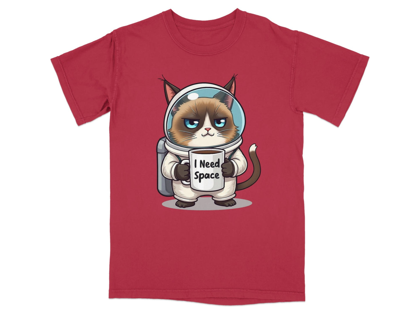 Funny astronaut cat t-shirt with grumpy cat holding 'I Need Space' mug, perfect for cat lovers and space fans.