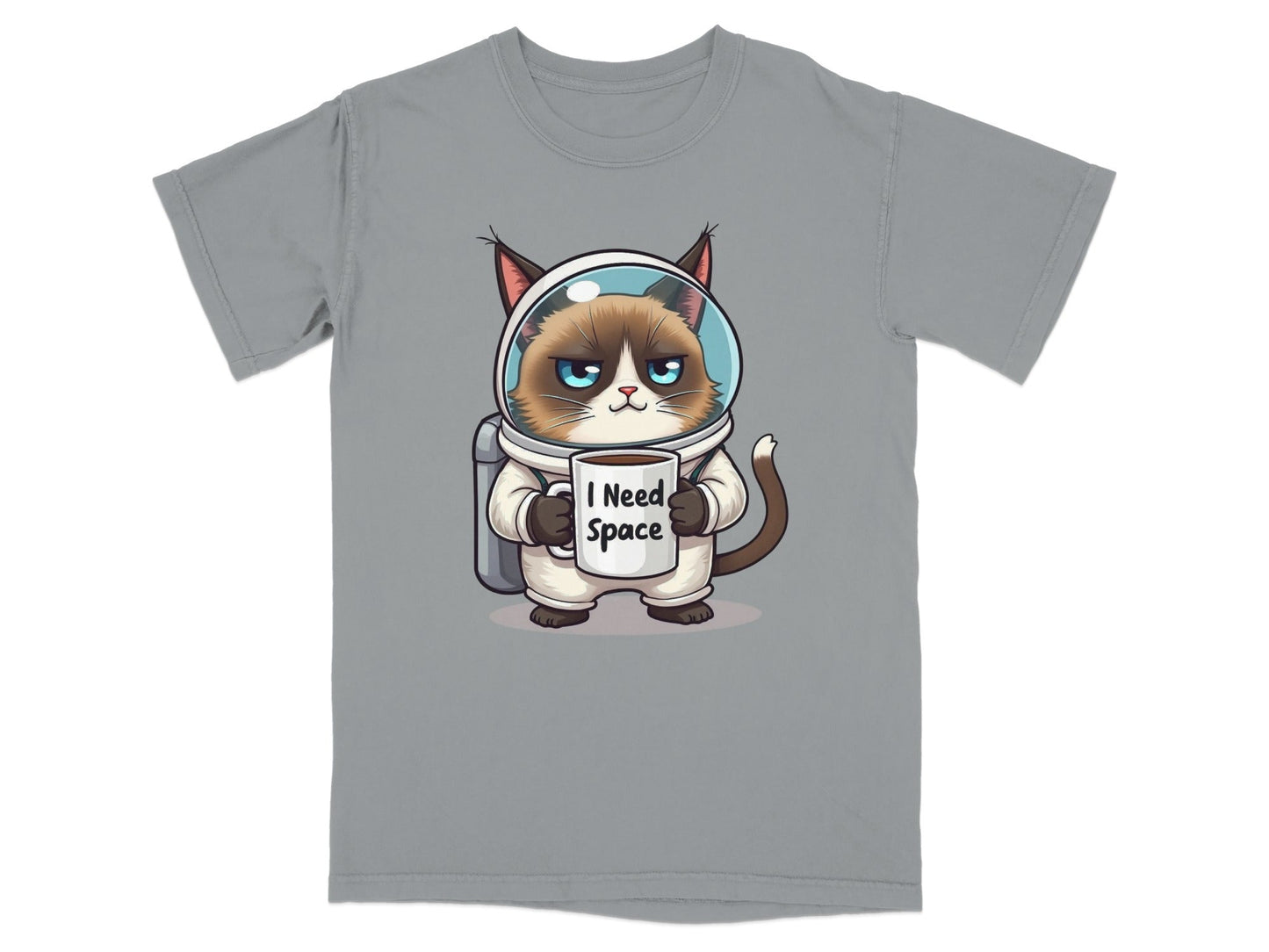 Funny astronaut cat t-shirt with grumpy cat in spacesuit holding mug that says 'I Need Space'.