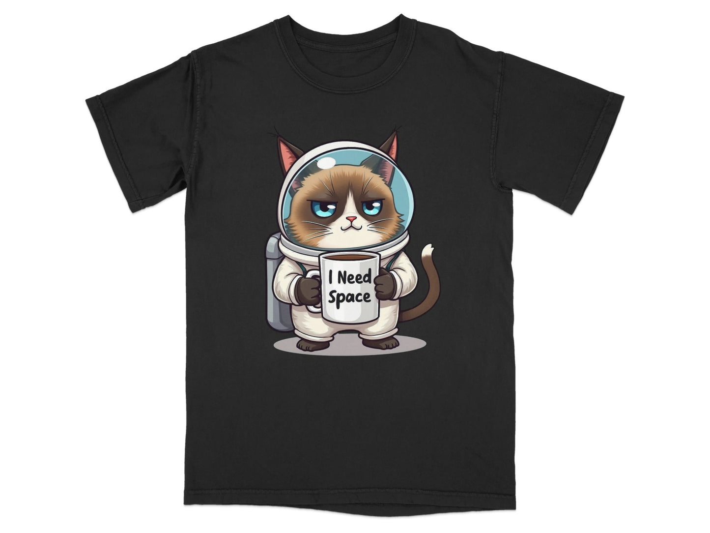 Funny astronaut cat t-shirt featuring a grumpy cat in a spacesuit holding a mug that says 'I Need Space'.