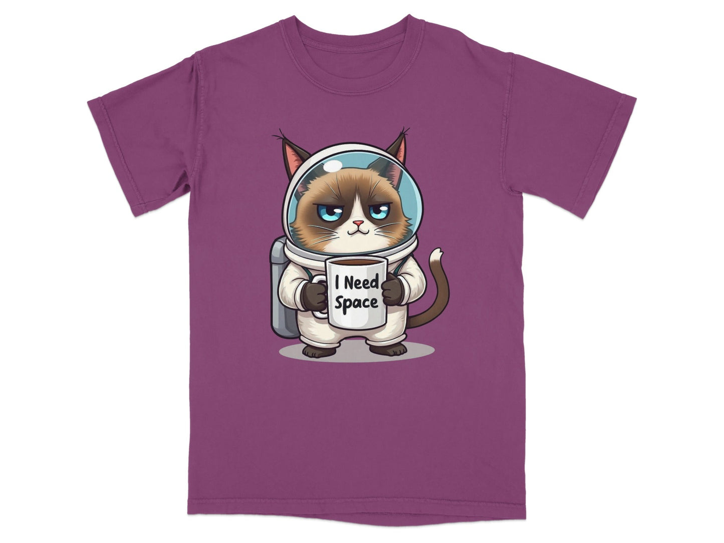 Funny astronaut cat t-shirt in purple, featuring a grumpy cat with a mug saying 'I Need Space'.