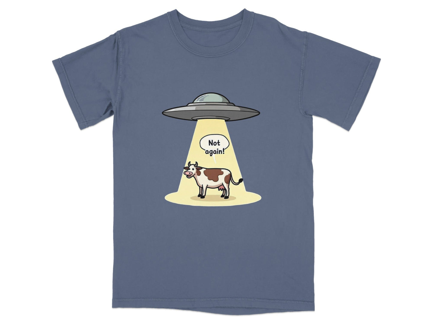 Funny t-shirt design featuring a cow being abducted by aliens with a 'Not again!' speech bubble.