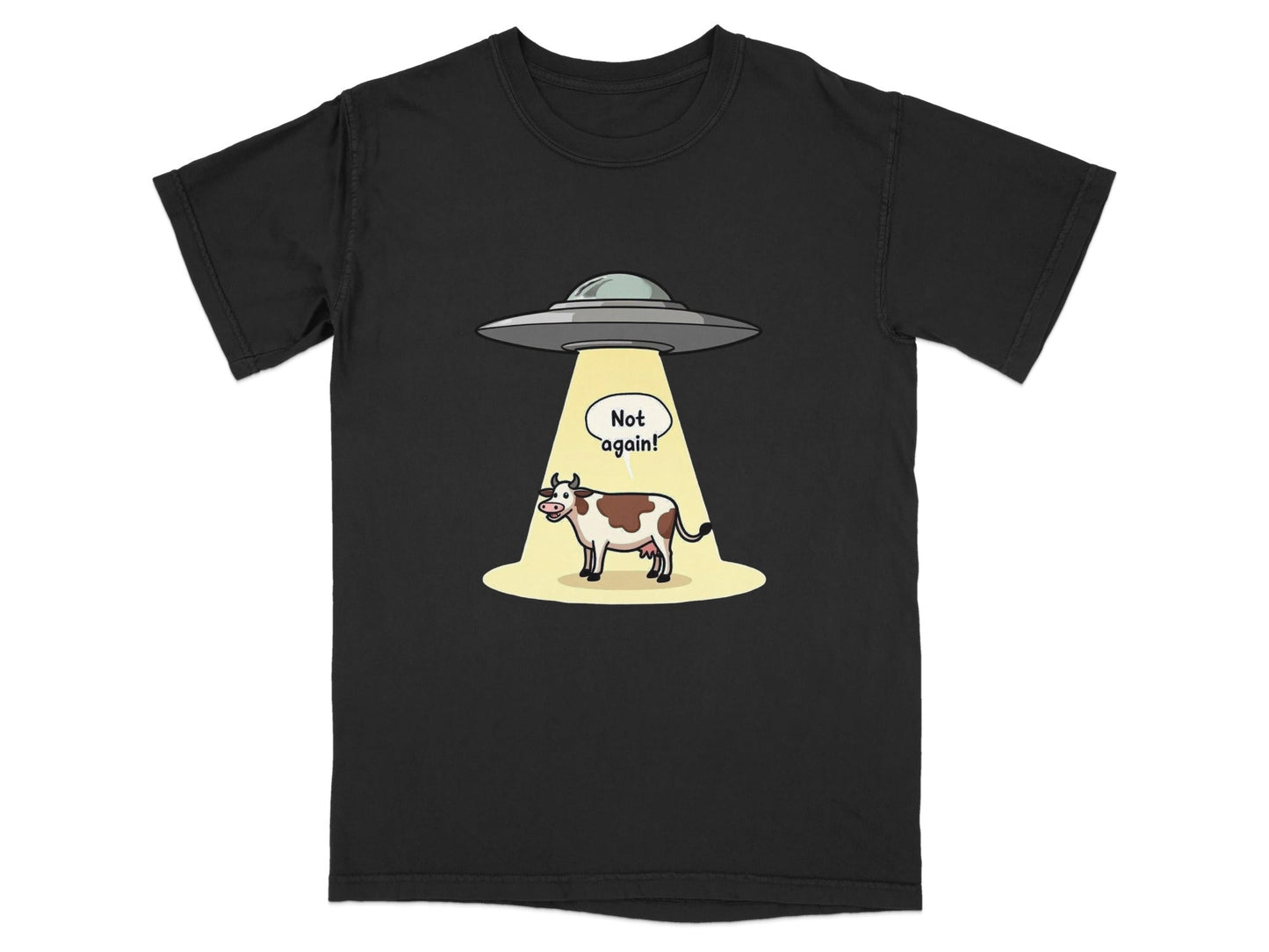 Funny alien abduction t-shirt featuring a cow with a speech bubble saying 'Not Again!'