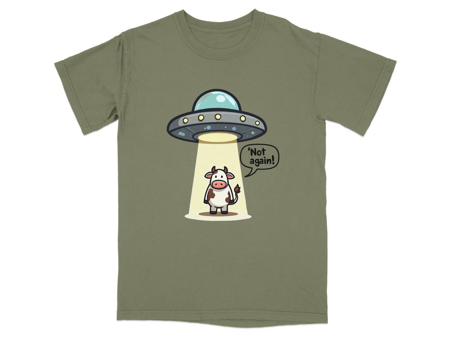 Funny alien abduction cow T-shirt featuring cartoon cow saying 'Not again!' on a relaxed fit shirt.