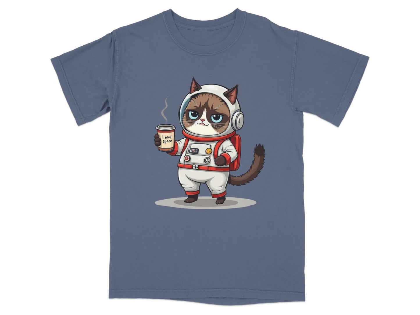 Grumpy astronaut cat holding a coffee cup wearing a space suit on a blue t-shirt design.