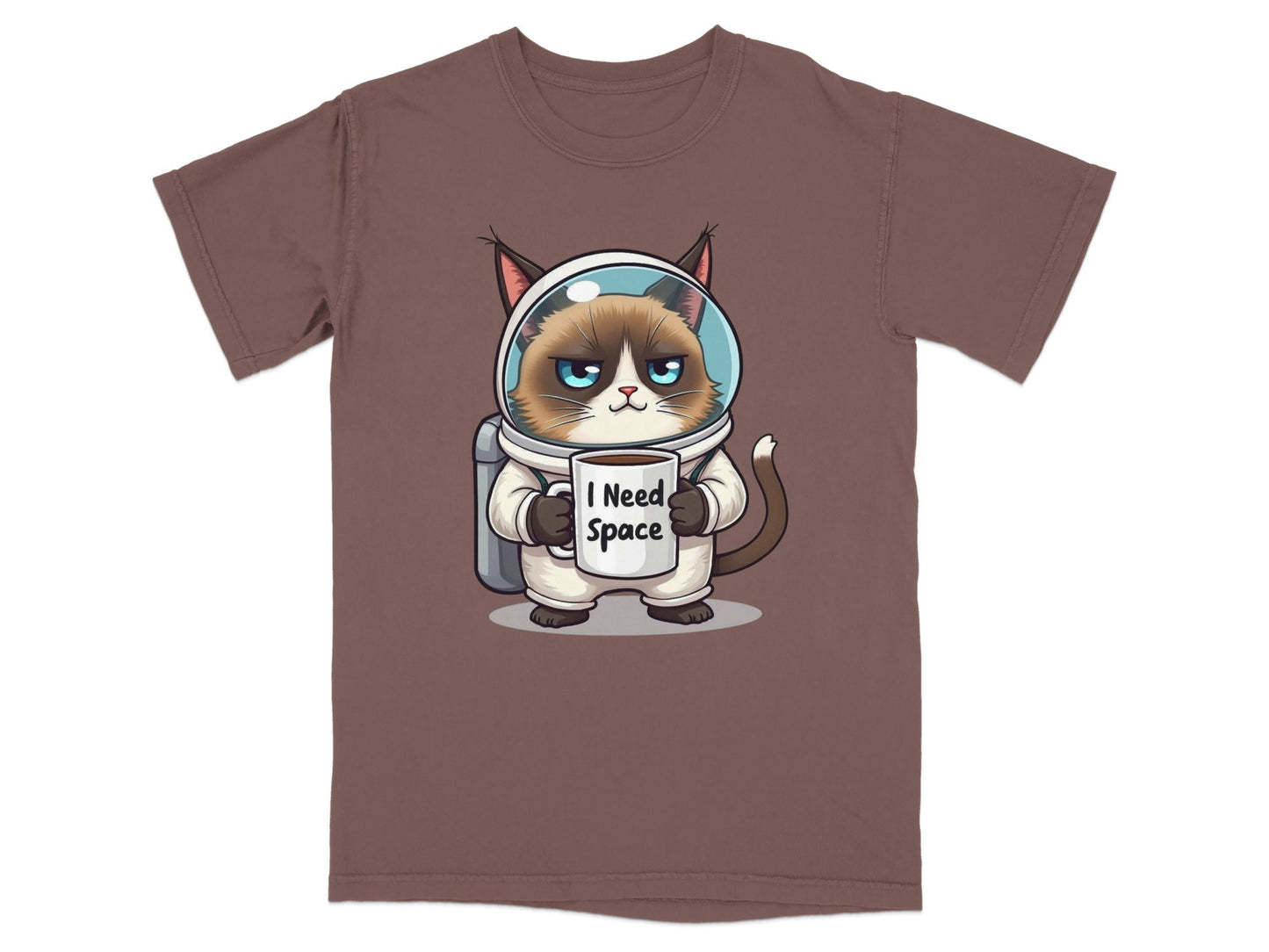 Funny astronaut cat t-shirt featuring a grumpy cat in spacesuit holding a mug that says "I Need Space".
