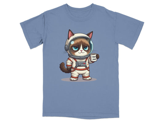 Cute astronaut cat graphic T-shirt design featuring a cat in a space suit with a "I Need Space" sign.