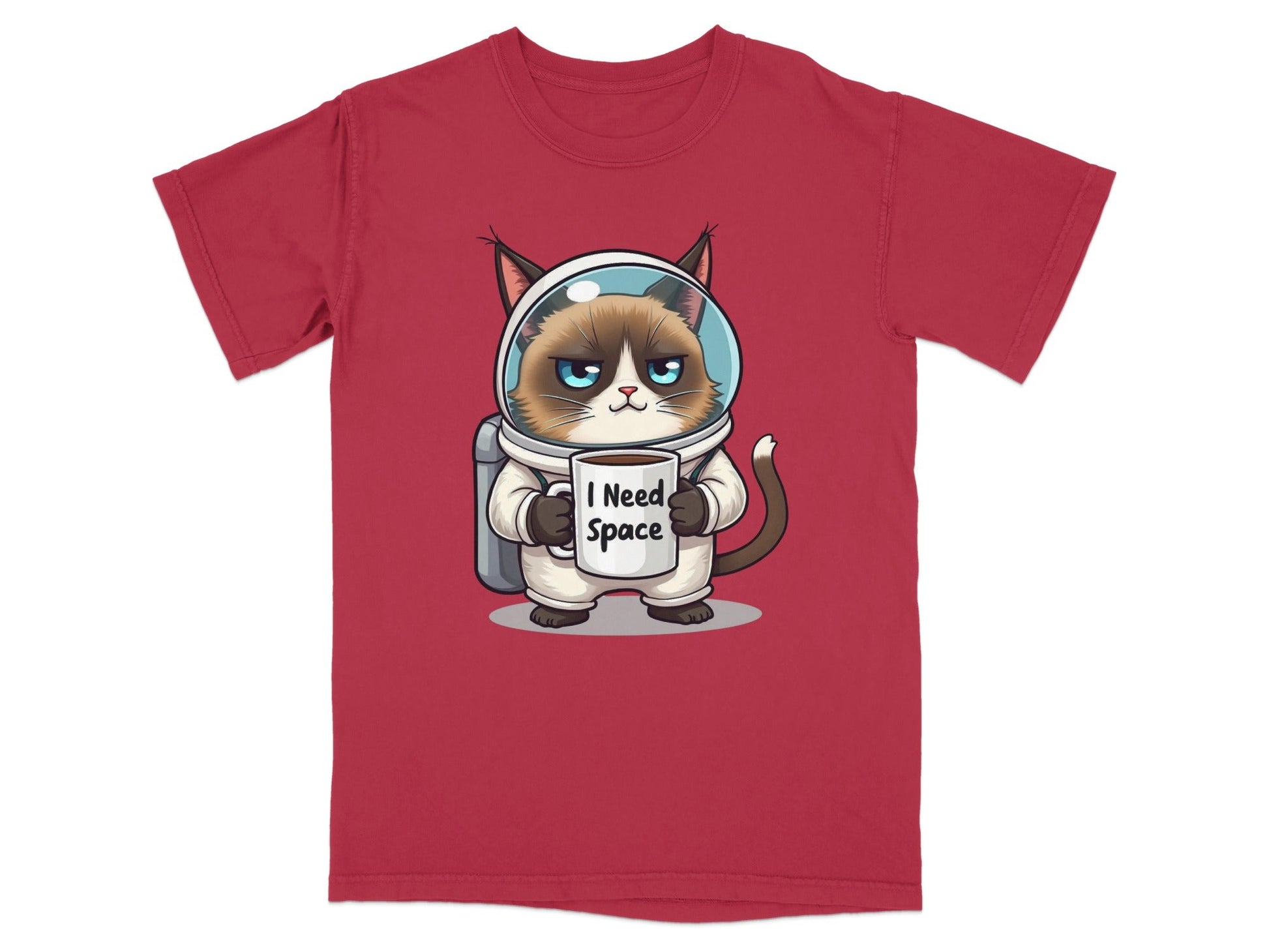 Funny astronaut cat t-shirt with grumpy cat holding 'I Need Space' mug, perfect for cat lovers and space fans.