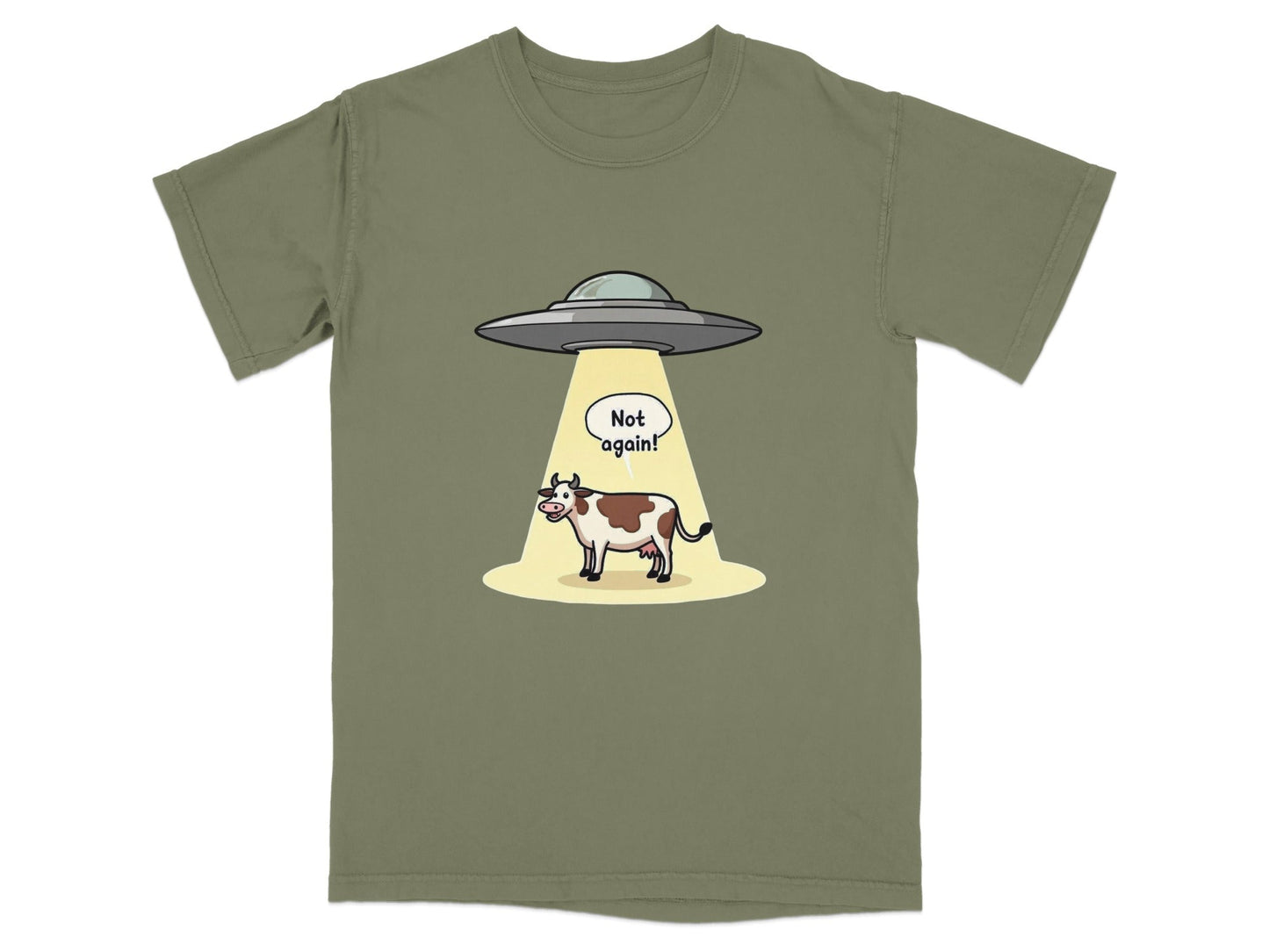 Funny T-shirt design of a cow being abducted by aliens with a 'Not again!' speech bubble.