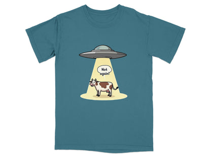 Funny t-shirt design with a cow abducted by aliens and a 'Not again!' speech bubble.