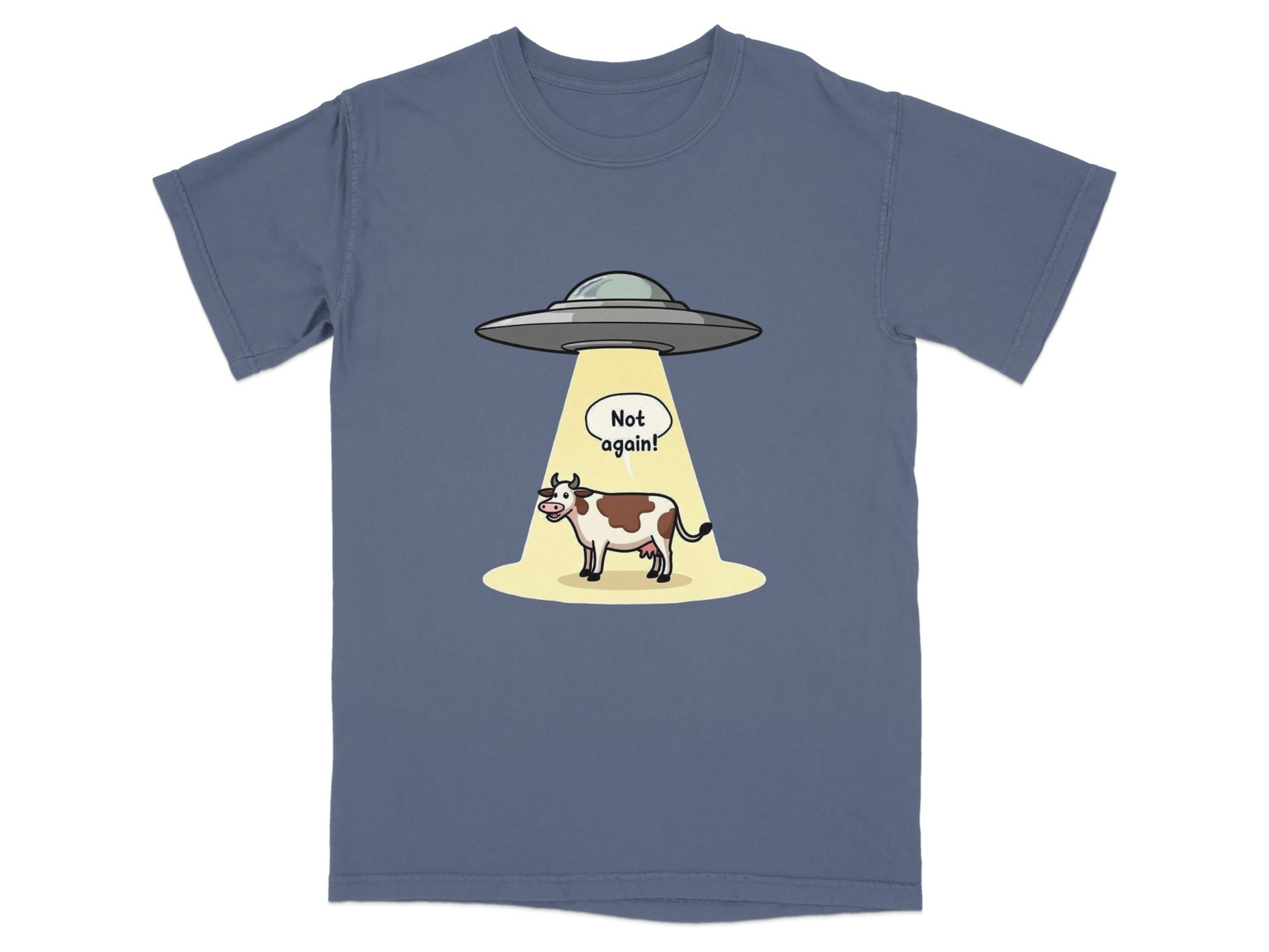 Funny t-shirt design featuring a cow being abducted by aliens with a 'Not again!' speech bubble.