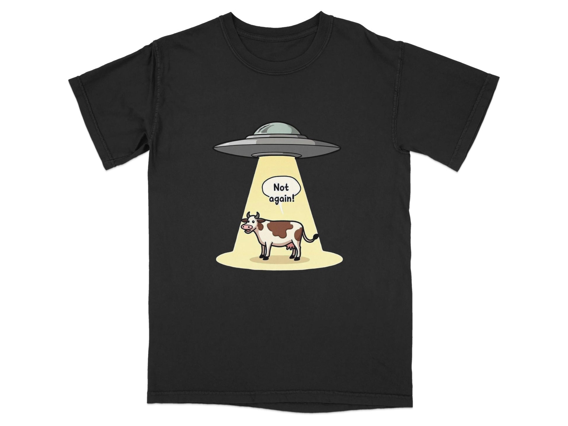 Funny alien abduction t-shirt featuring a cow with a speech bubble saying 'Not Again!'