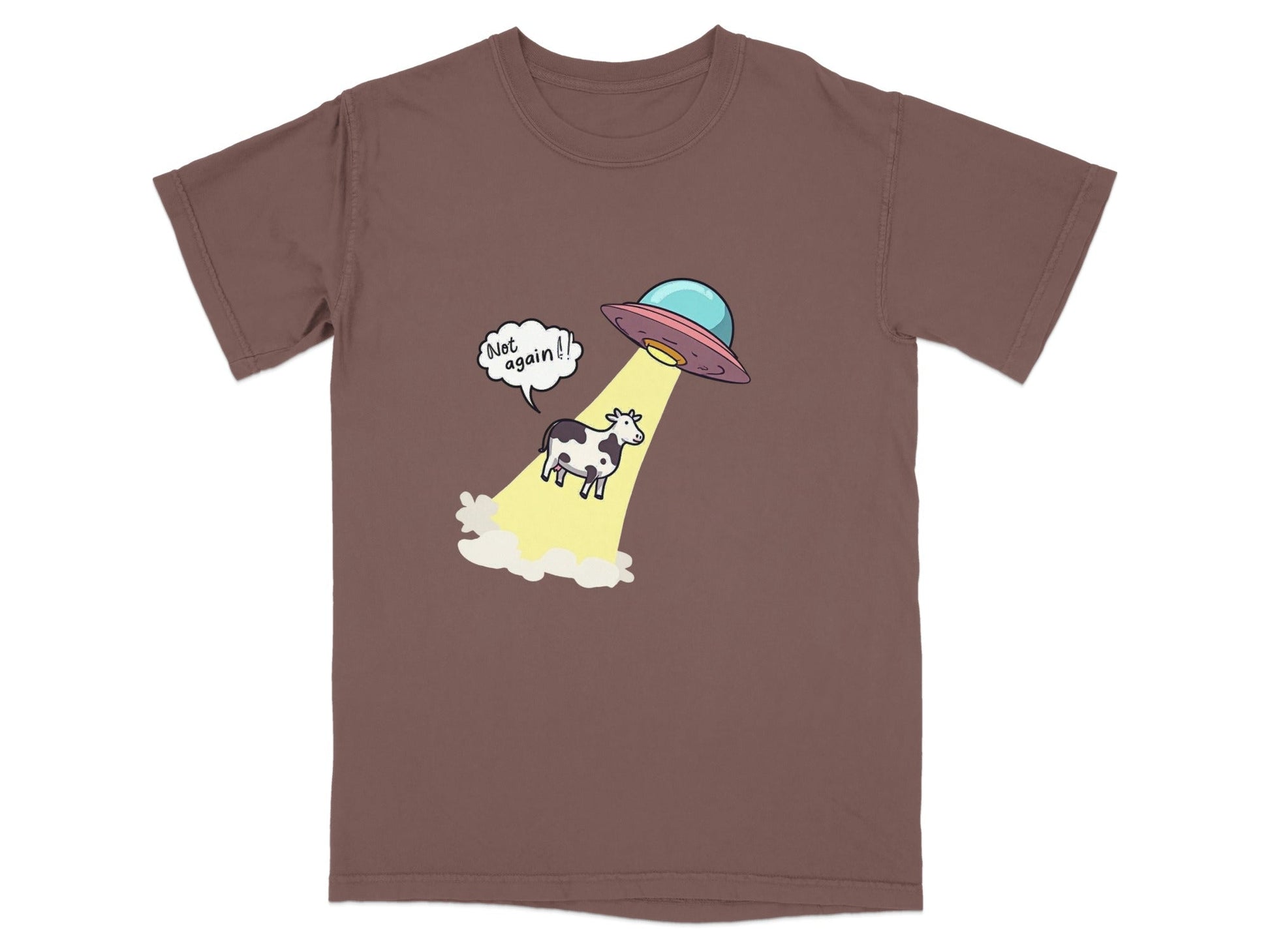 Funny alien abduction t-shirt featuring a cow being beamed up by a UFO with a speech bubble saying 'Not Again!'