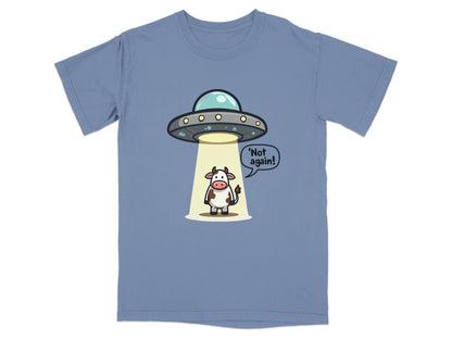 Funny blue T-shirt featuring an alien spaceship and cow with text 'Not again!' for humor enthusiasts.