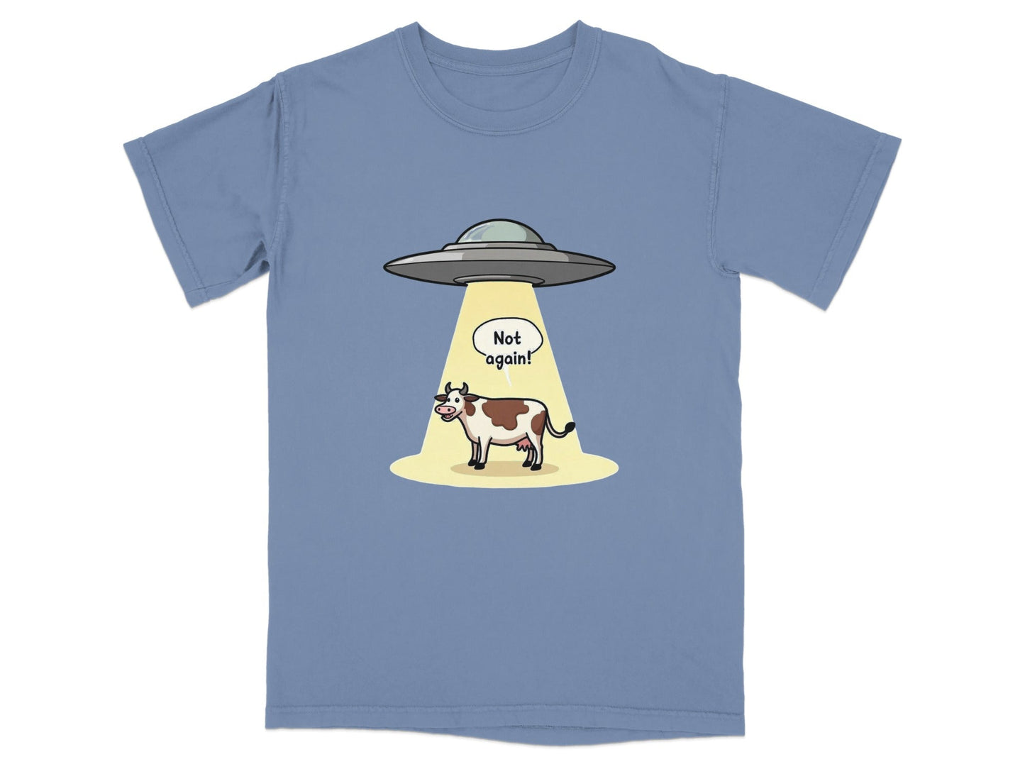 Funny t-shirt design featuring a cow being abducted by aliens with the text 'Not again!' in a cartoon style.