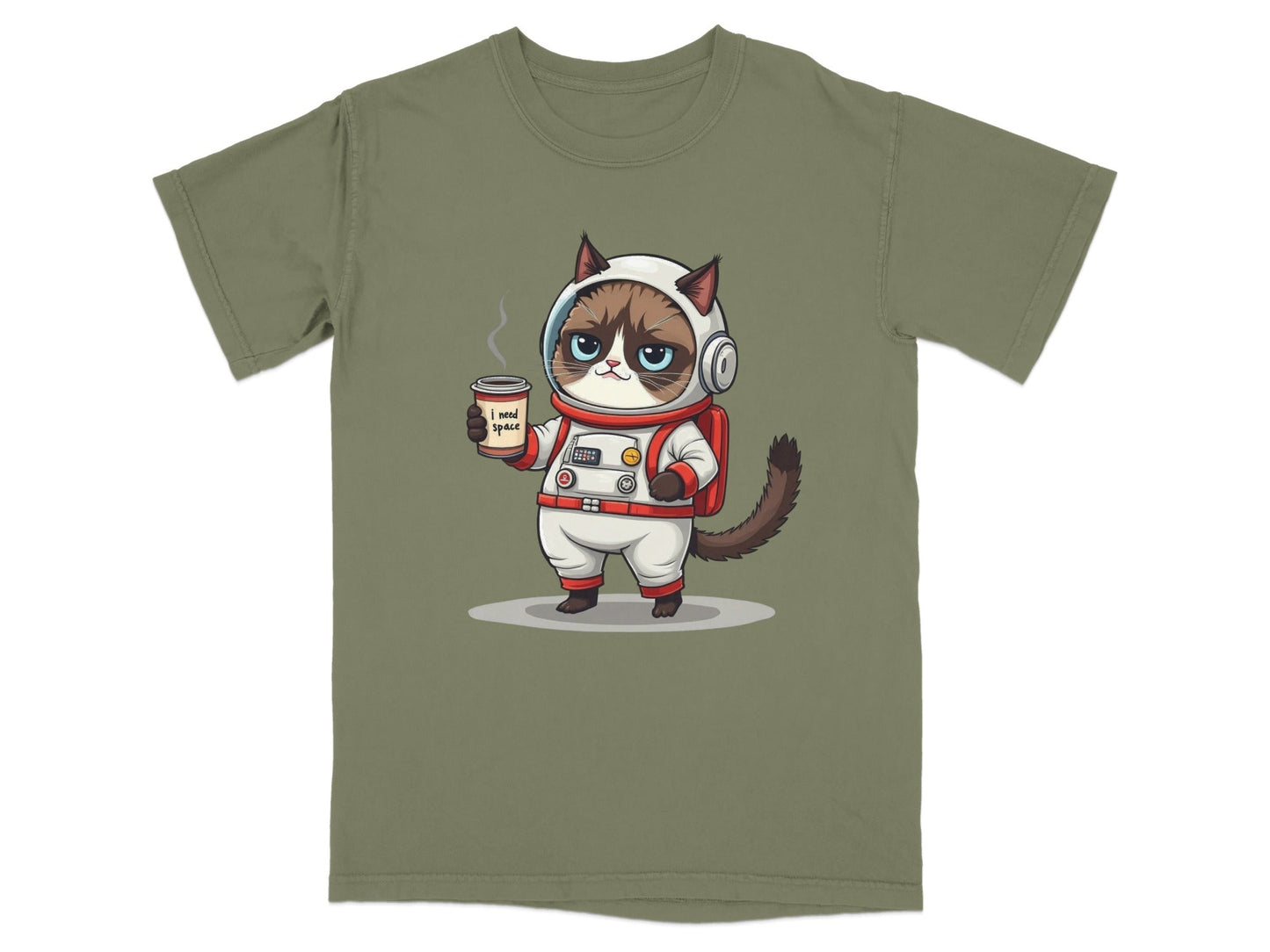 Grumpy astronaut cat holding coffee on 'I Need Space' graphic novelty T-shirt in olive green.
