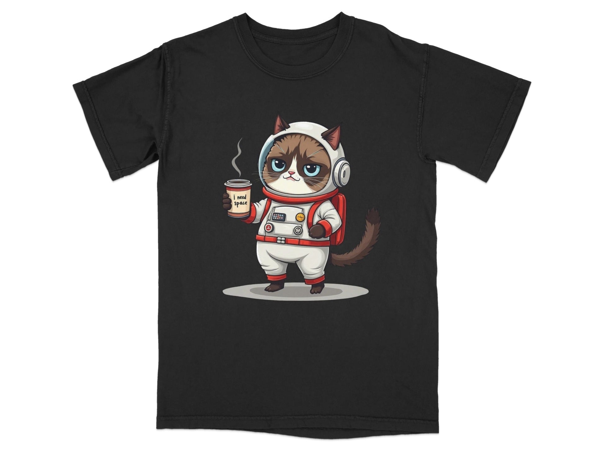 Grumpy astronaut cat graphic novelty t-shirt with 'I need space' design holding a coffee cup.