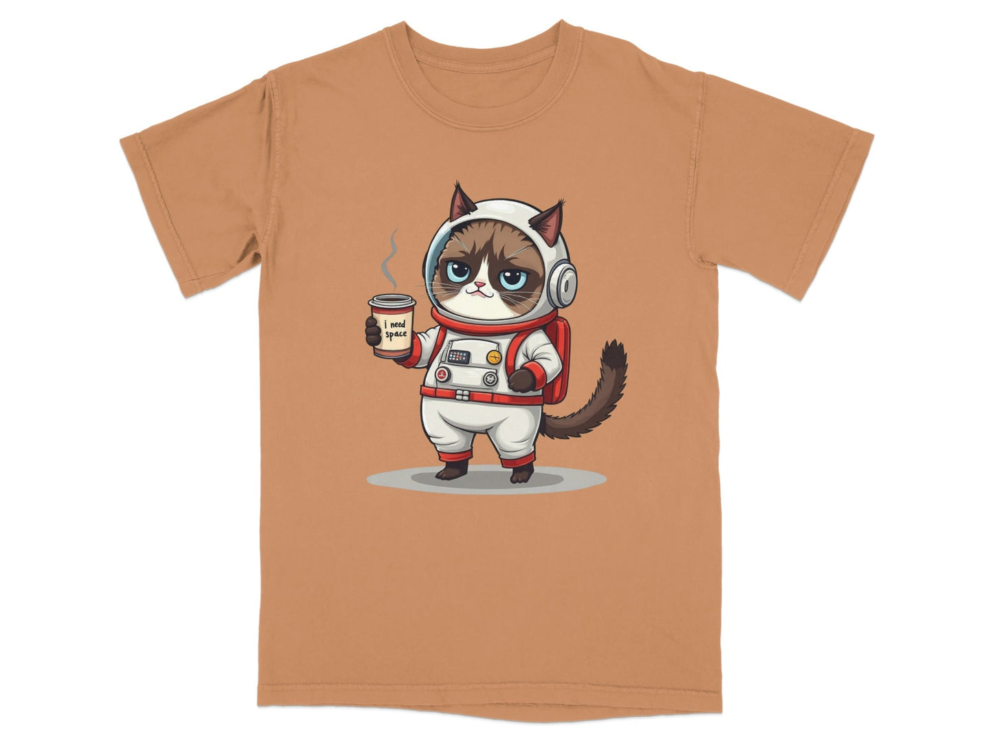Cute grumpy astronaut cat in a spacesuit holding coffee on a t-shirt with 'I need space' graphic design.