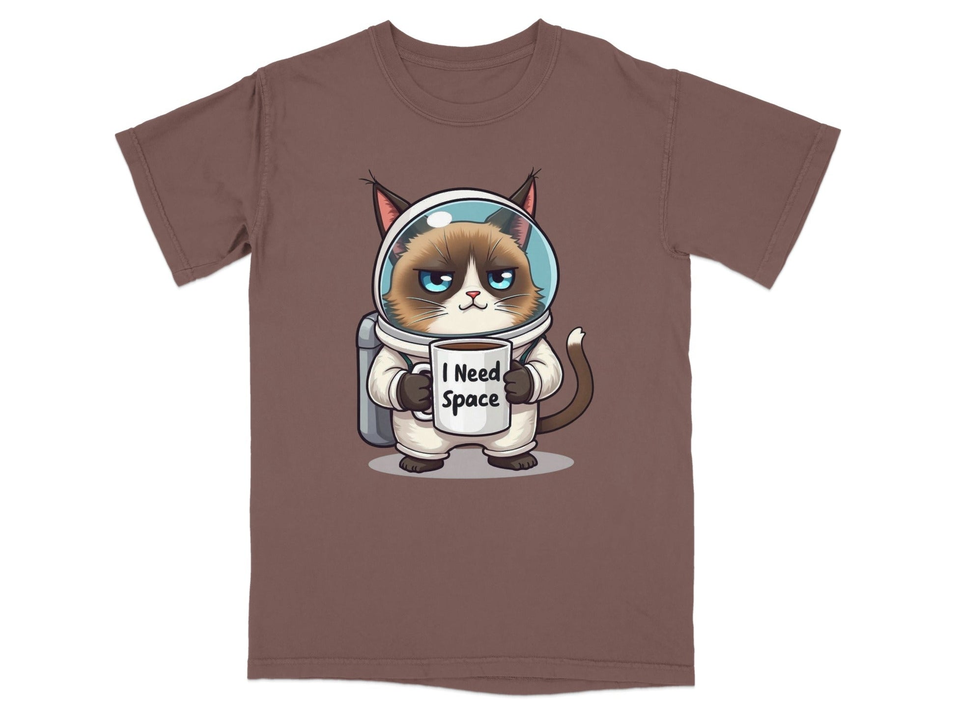 Funny astronaut cat t-shirt featuring a grumpy cat in spacesuit holding a mug that says "I Need Space".