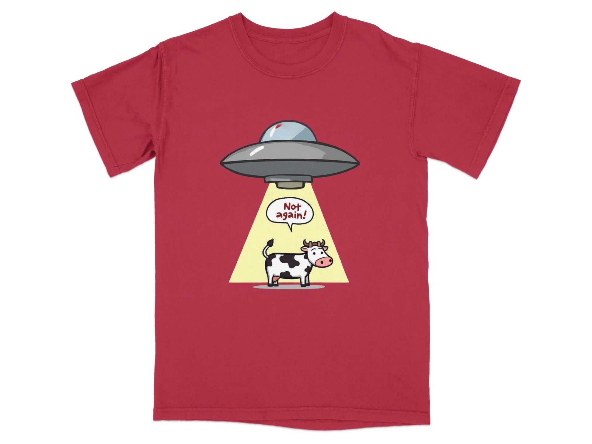 Funny cartoon t-shirt featuring a cow being abducted by a UFO with the text 'Not again!'. Perfect for sci-fi fans.