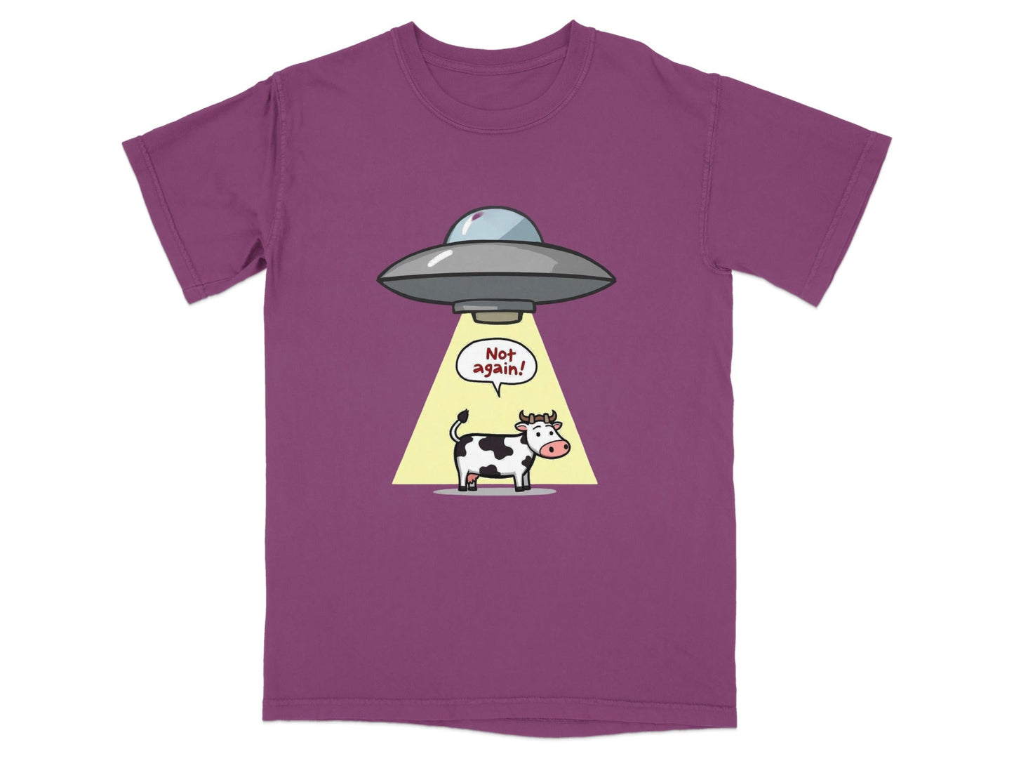 Funny cartoon cow abduction T-shirt featuring a cow under a UFO with the text 'Not again!', perfect for sci-fi fans.