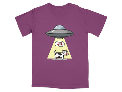 Funny cartoon cow abduction T-shirt featuring a cow under a UFO with the text 'Not again!', perfect for sci-fi fans.