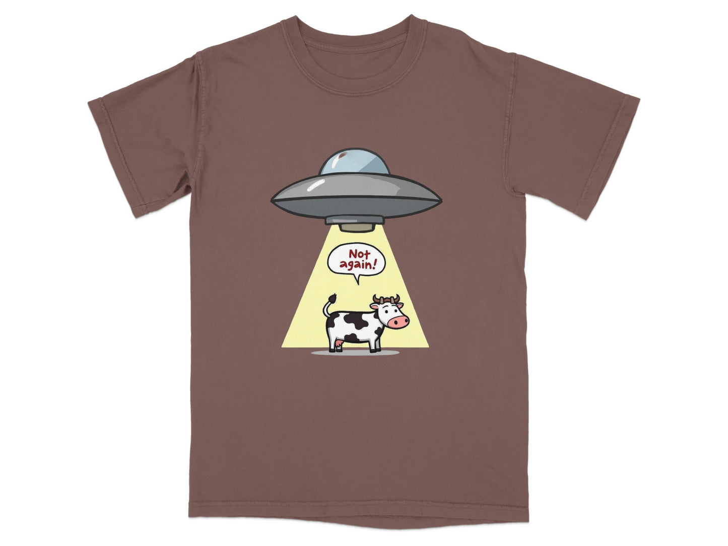 Funny cow abduction cartoon graphic on brown T-shirt with alien spaceship saying "Not again!"