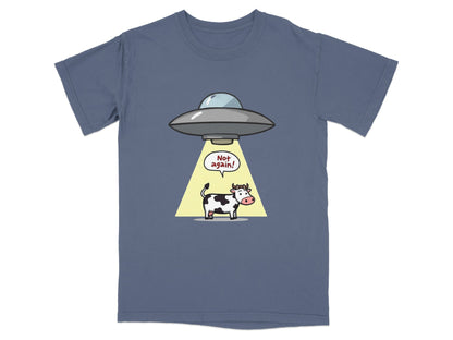 Funny cartoon t-shirt featuring a cow being abducted by a UFO with text saying 'Not again!' Perfect for sci-fi fans.