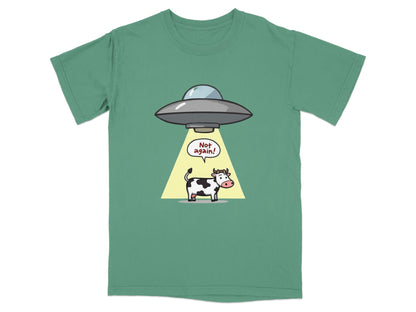 Funny cartoon t-shirt featuring a cow being abducted by a UFO with 'Not again!' text, perfect for sci-fi enthusiasts.