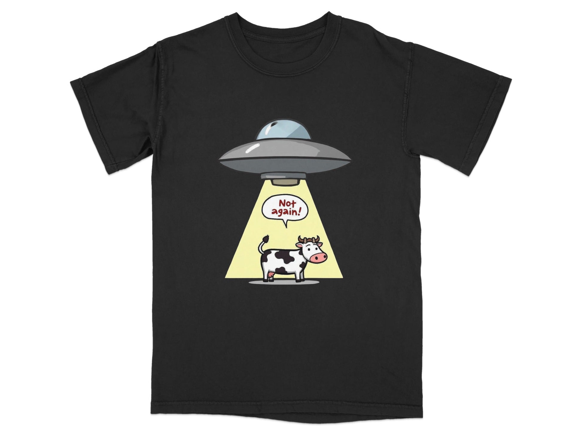 Funny cow abduction graphic on a black T-shirt, ideal for alien and sci-fi humor lovers.