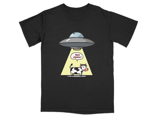Funny cow abduction graphic on a black T-shirt, ideal for alien and sci-fi humor lovers.